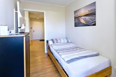 Ein Bett oder Betten in einem Zimmer der Unterkunft Kapitän Alexander, KA44