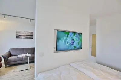 Ein Bett oder Betten in einem Zimmer der Unterkunft Hohe Worth, H209