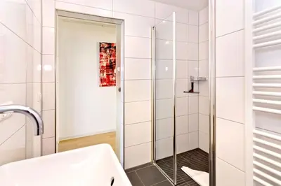 Ein Badezimmer in der Unterkunft Am Seedeich 14, AS1