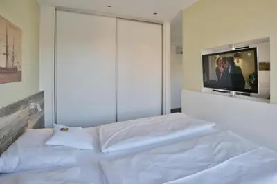 Ein Bett oder Betten in einem Zimmer der Unterkunft Duhner Strandhus, S201