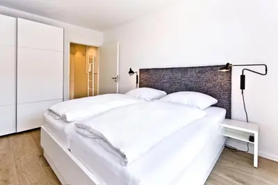 Ein Bett oder Betten in einem Zimmer der Unterkunft Duhner Spitze, DS54
