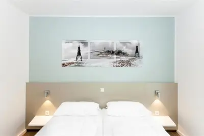 Ein Bett oder Betten in einem Zimmer der Unterkunft Duhner Brandung, B6