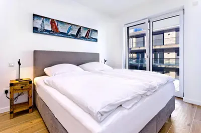 Ein Bett oder Betten in einem Zimmer der Unterkunft Duhner Spitze, DS18