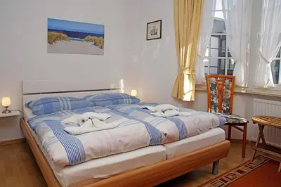 Ein Bett oder Betten in einem Zimmer der Unterkunft Fischerhus, Whg 1