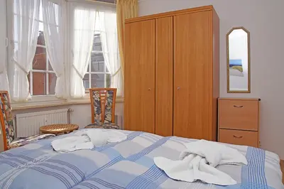 Ein Bett oder Betten in einem Zimmer der Unterkunft Fischerhus, Whg 1