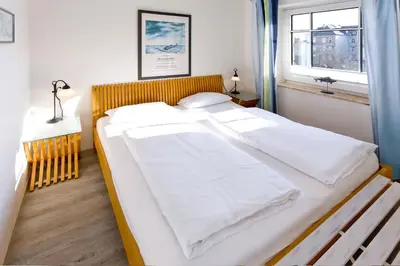 Ein Bett oder Betten in einem Zimmer der Unterkunft Am Seedeich 17, AS177