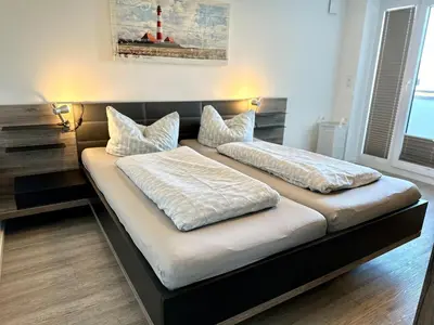 Ein Bett oder Betten in einem Zimmer der Unterkunft Ferienwohnung De Föhr