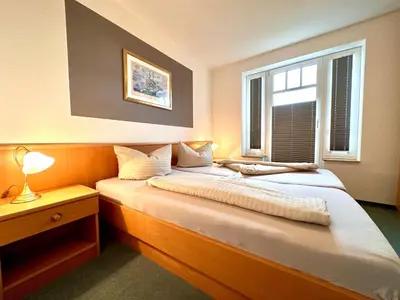 Ein Bett oder Betten in einem Zimmer der Unterkunft Ferienwohnung De Fieffööt