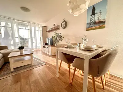 Ein Sitzbereich in der Unterkunft Ferienwohnung De Diek 103