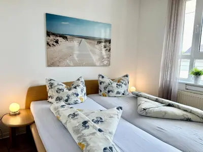 Ein Bett oder Betten in einem Zimmer der Unterkunft Ferienwohnung De Diek 103