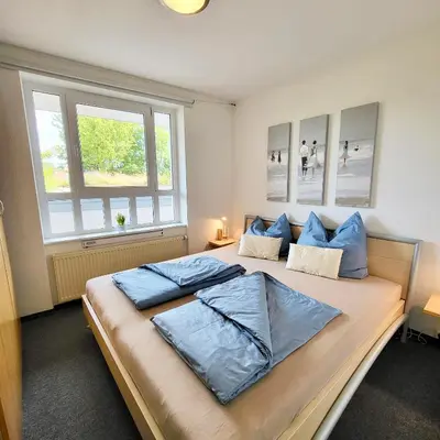 Ein Bett oder Betten in einem Zimmer der Unterkunft Ferienwohnung De Floot