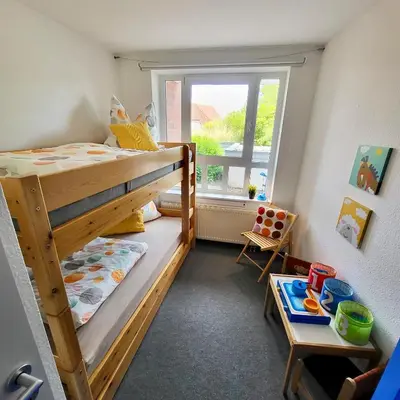 Ein Bett oder Betten in einem Zimmer der Unterkunft Ferienwohnung De Floot