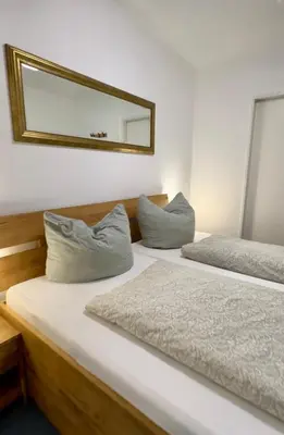 Ein Bett oder Betten in einem Zimmer der Unterkunft Ferienwohnung De Ligger