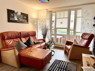 Ein Sitzbereich in der Unterkunft Ferienwohnung De Ööster