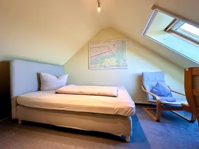 Ein Bett oder Betten in einem Zimmer der Unterkunft Ferienwohnung De Snieder