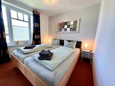 Ein Bett oder Betten in einem Zimmer der Unterkunft Ferienwohnung De Drückdaal