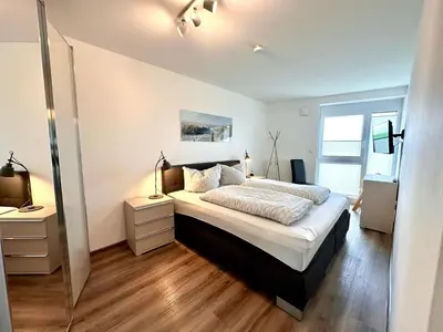 Ein Bett oder Betten in einem Zimmer der Unterkunft Ferienwohnung de Gleemfisk