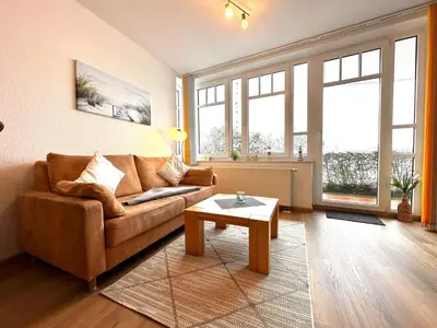 Ein Sitzbereich in der Unterkunft Ferienwohnung De Grasviol