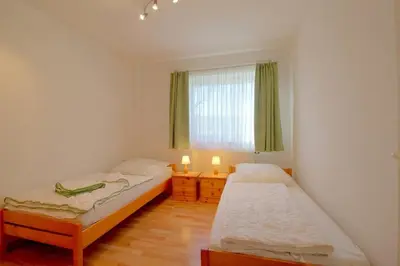 Ein Bett oder Betten in einem Zimmer der Unterkunft DW10a FeWo Pottkieker