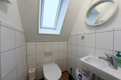 Ein Badezimmer in der Unterkunft SV2 Robbenplate 18 Ferienhaus Robbe