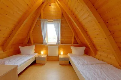 Ein Bett oder Betten in einem Zimmer der Unterkunft SV2 Ostertill 14