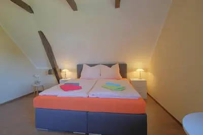 Ein Bett oder Betten in einem Zimmer der Unterkunft Gästehaus Dorum 05