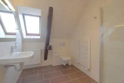 Ein Badezimmer in der Unterkunft Gästehaus Dorum 05