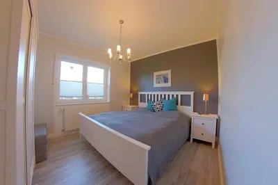 Ein Bett oder Betten in einem Zimmer der Unterkunft SI5-01 Terrassenwohnung Deichnah