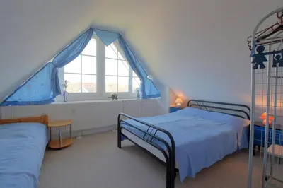 Ein Bett oder Betten in einem Zimmer der Unterkunft KI 22 Haus Seeadler WE 15