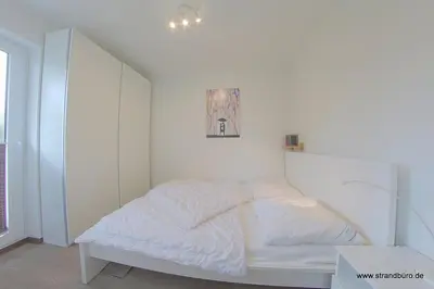 Ein Bett oder Betten in einem Zimmer der Unterkunft Haus Amrum WE 11