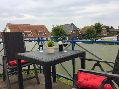 Ein Balkon oder eine Terrasse in der Unterkunft PM11 FeWo Leuchtturm Wremen