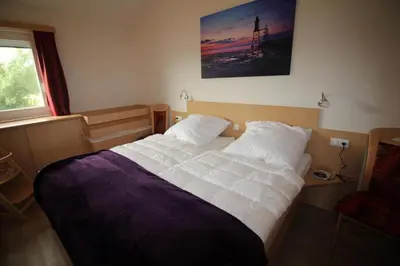 Ein Bett oder Betten in einem Zimmer der Unterkunft Strandnixe Mellumplate 7