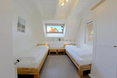 Ein Bett oder Betten in einem Zimmer der Unterkunft SV3 Medemsand 10