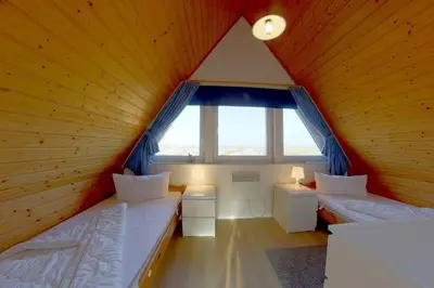 Ein Bett oder Betten in einem Zimmer der Unterkunft SR Nordertill 7