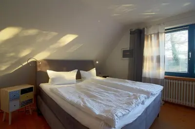 Ein Bett oder Betten in einem Zimmer der Unterkunft KA6 Haus Küstenzeit