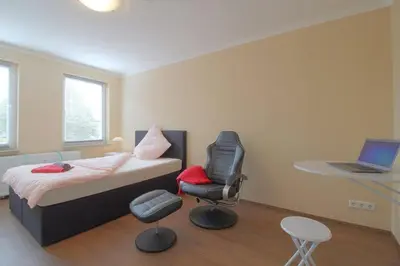 Ein Bett oder Betten in einem Zimmer der Unterkunft Gästehaus Dorum 02