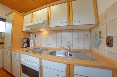 Küche/Küchenzeile in der Unterkunft SW6 Haus Wittsand