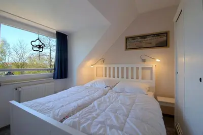 Ein Bett oder Betten in einem Zimmer der Unterkunft KD2-08 Seemöwe