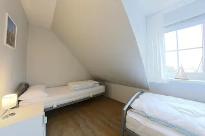 Ein Bett oder Betten in einem Zimmer der Unterkunft KI8a Ferienhaus Ruby