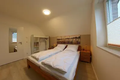 Ein Bett oder Betten in einem Zimmer der Unterkunft AE13 Engelsbrise