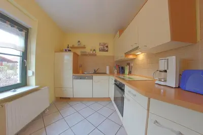 Küche/Küchenzeile in der Unterkunft KW19 Ferienhaus Kormoranweg