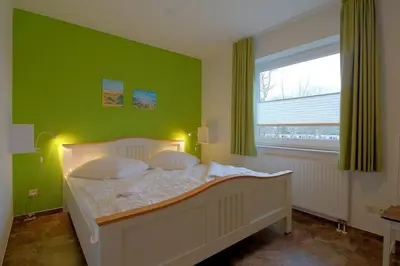 Ein Bett oder Betten in einem Zimmer der Unterkunft Lilli Marleen WE 25