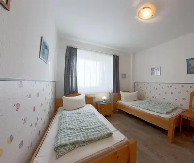 Ein Bett oder Betten in einem Zimmer der Unterkunft DW10a FeWo Diekkieker
