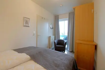 Ein Bett oder Betten in einem Zimmer der Unterkunft Haus Borkum WE 19