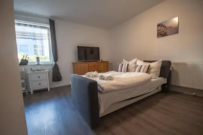 Ein Bett oder Betten in einem Zimmer der Unterkunft Neue Reihe 8 FeWo rechts
