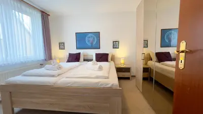 Ein Bett oder Betten in einem Zimmer der Unterkunft Haus Nordseeperle FeWo 4