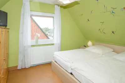 Ein Bett oder Betten in einem Zimmer der Unterkunft Ferienhaus, Kleine Perle