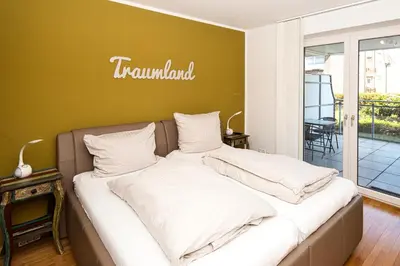 Ein Bett oder Betten in einem Zimmer der Unterkunft Strandpalais, FeWo SP104
