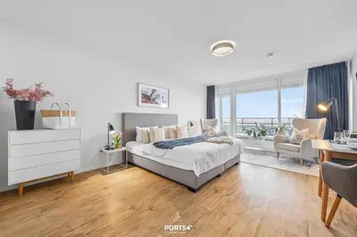 Ein Bett oder Betten in einem Zimmer der Unterkunft Ferienwohnung Seeblick 203 Büsum
