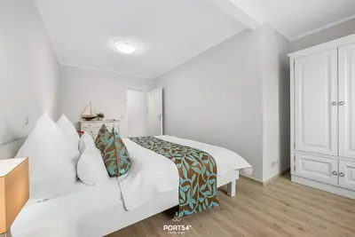 Ein Bett oder Betten in einem Zimmer der Unterkunft Ferienwohnung Muschel Büsum